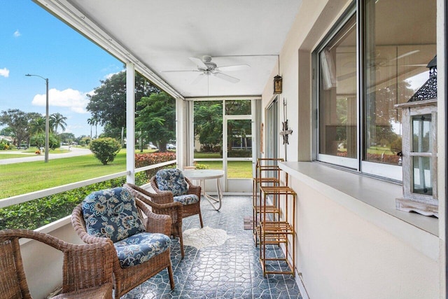 sunroom / solarium with plenty of natural light and ceiling fan