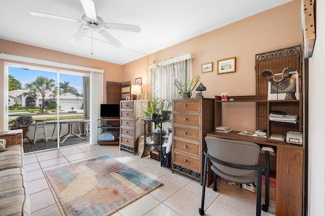 office space with ceiling fan and light tile patterned floors