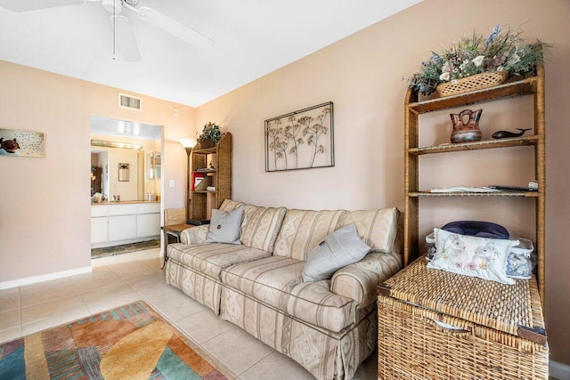 living room featuring ceiling fan and light tile patterned floors