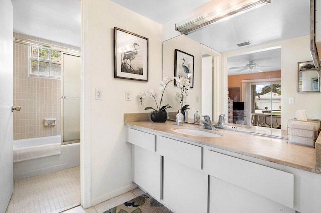 bathroom featuring tile patterned floors, vanity, bath / shower combo with glass door, and a wealth of natural light