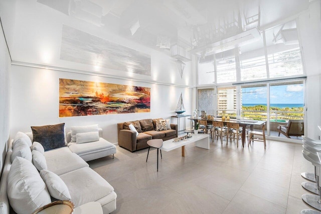 living room featuring a high ceiling