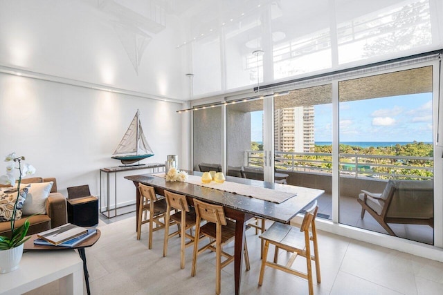 tiled dining area with a water view