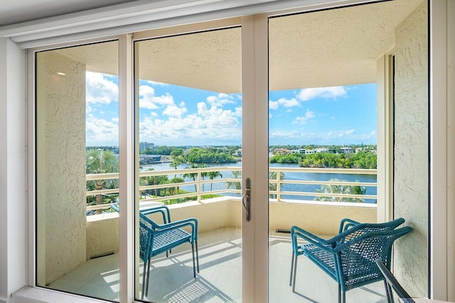 balcony featuring a water view