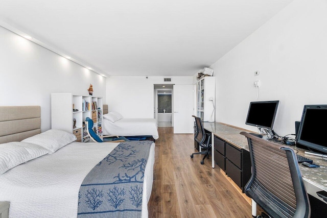 bedroom featuring hardwood / wood-style floors