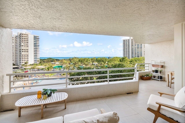 balcony featuring a water view