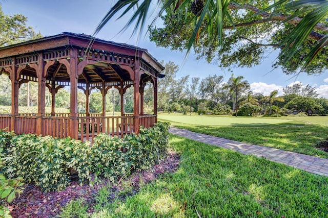 view of property's community with a gazebo and a lawn