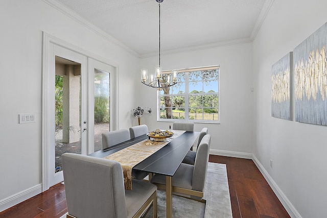 dining area featuring ornamental molding, dark wood-type flooring, and french doors