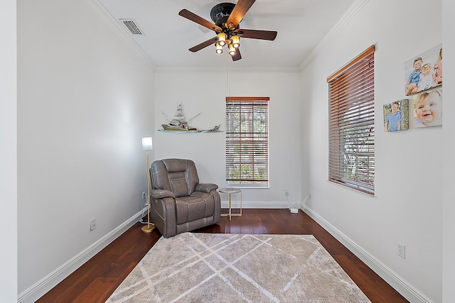 sitting room featuring ceiling fan, dark hardwood / wood-style flooring, and ornamental molding