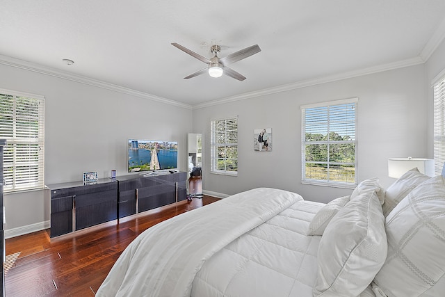 bedroom with ornamental molding, dark wood-type flooring, and ceiling fan