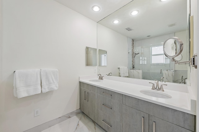 bathroom featuring vanity and an enclosed shower