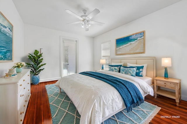 bedroom with ceiling fan and dark wood-type flooring