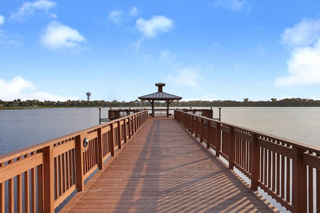 view of dock featuring a water view and a gazebo