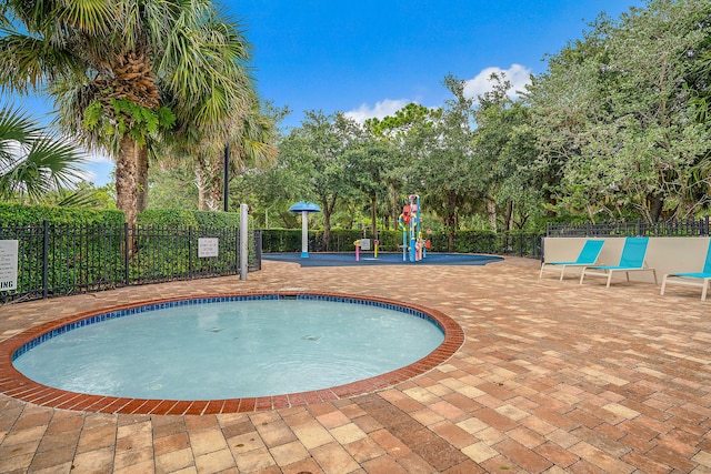 view of swimming pool with a patio area