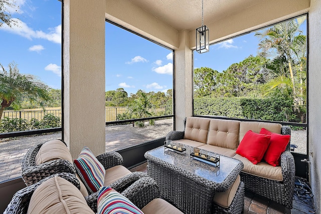 sunroom featuring a wealth of natural light