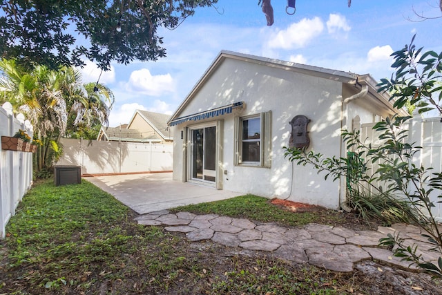 back of property with a patio area