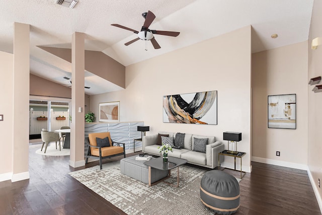 living room with a textured ceiling, ceiling fan, dark hardwood / wood-style floors, and lofted ceiling