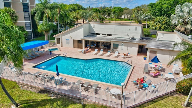 view of swimming pool with a patio area