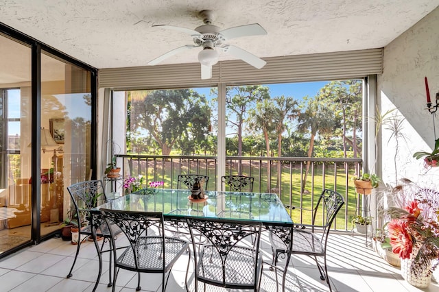 sunroom with plenty of natural light and ceiling fan