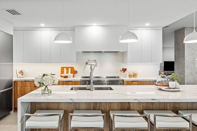 kitchen with white cabinets and pendant lighting