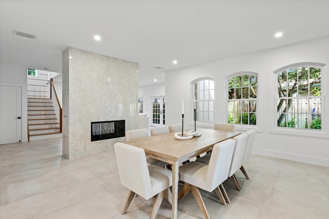 dining area featuring a premium fireplace