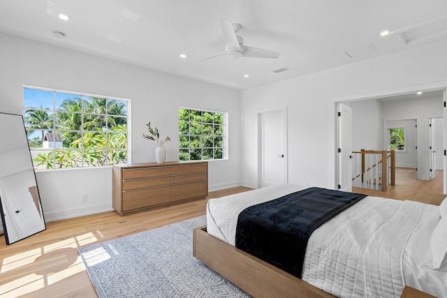 bedroom featuring ceiling fan and light wood-type flooring