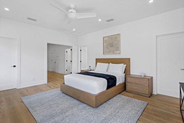 bedroom featuring light wood-type flooring and ceiling fan