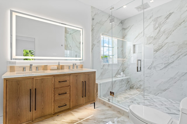 bathroom featuring vanity, toilet, and an enclosed shower