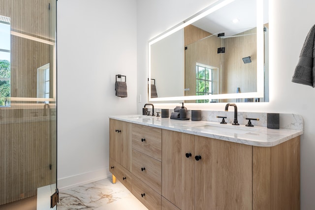 bathroom featuring vanity and an enclosed shower