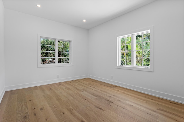 empty room with light hardwood / wood-style floors