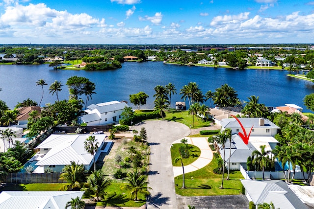 birds eye view of property with a water view