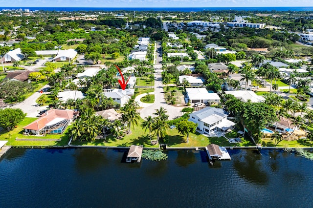 birds eye view of property featuring a water view