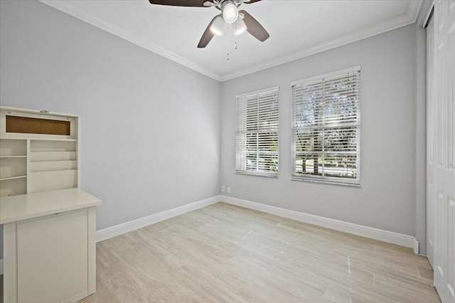 spare room featuring ceiling fan and ornamental molding