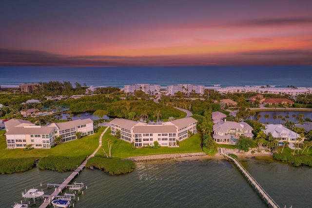 aerial view at dusk with a water view