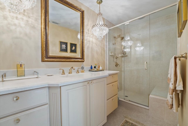 bathroom featuring a chandelier, vanity, walk in shower, and tile patterned flooring