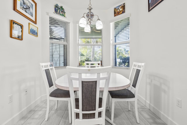 dining room featuring a chandelier