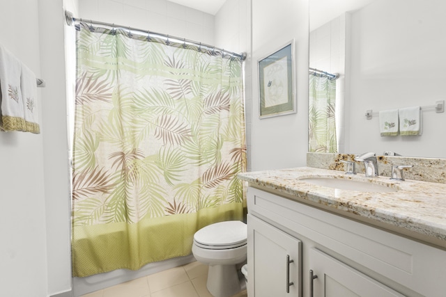 full bathroom featuring tile patterned floors, shower / bath combination with curtain, toilet, and vanity