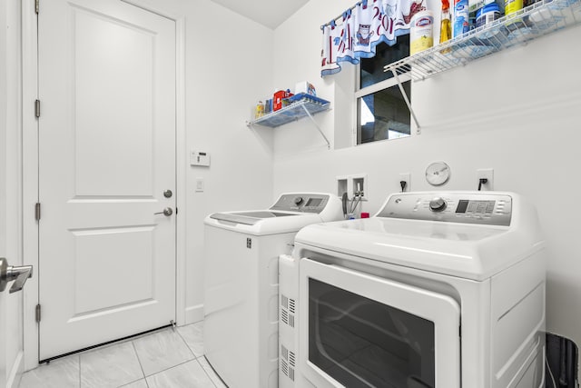 laundry room featuring washing machine and clothes dryer