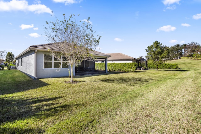 view of yard with a sunroom