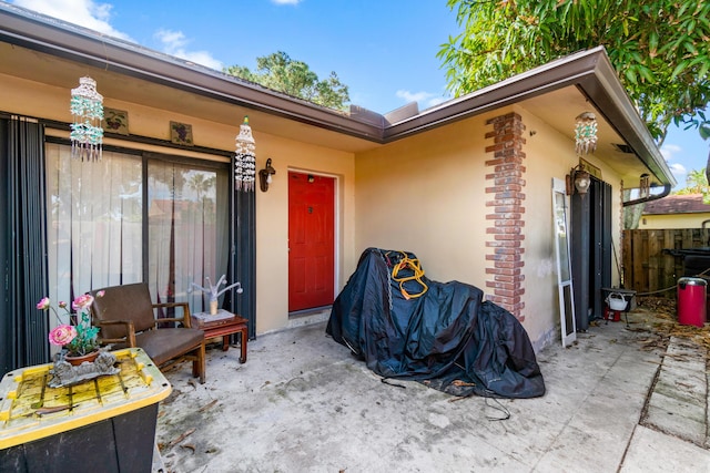 property entrance with a patio