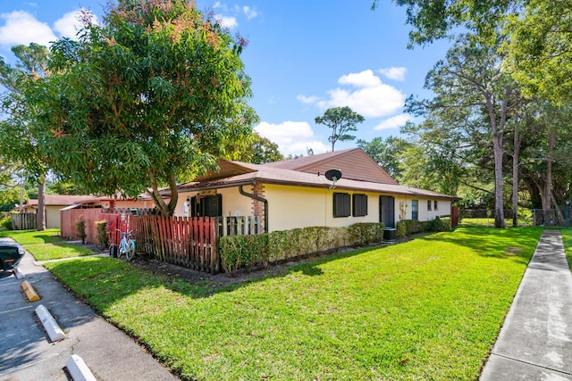 view of home's exterior with a lawn