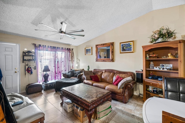 living room with a textured ceiling, vaulted ceiling, and ceiling fan