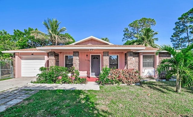 ranch-style house with a garage and a front yard