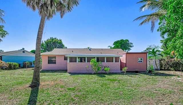 back of house with a yard