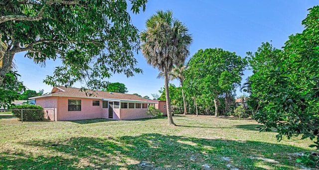 view of yard with a sunroom