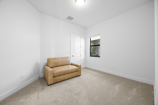 sitting room featuring carpet floors