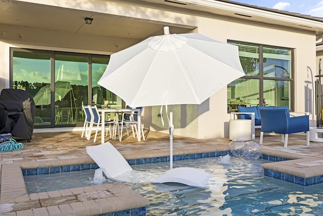 view of patio / terrace featuring pool water feature