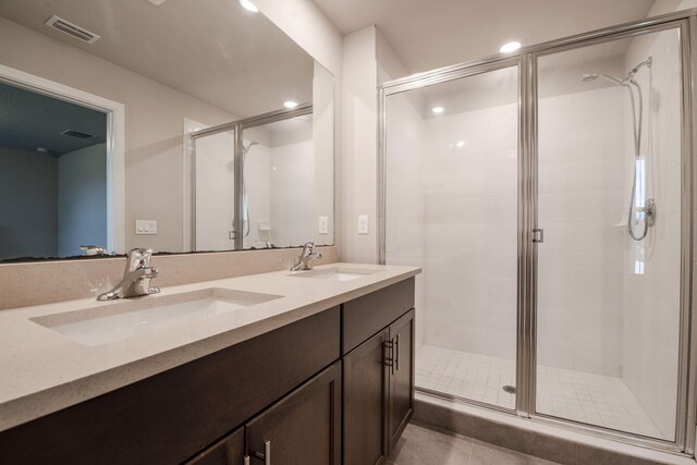 6341 Topsail Dr, West Palm Beach, FL 33413 - full bathroom featuring double vanity, a stall shower, and tile patterned floors