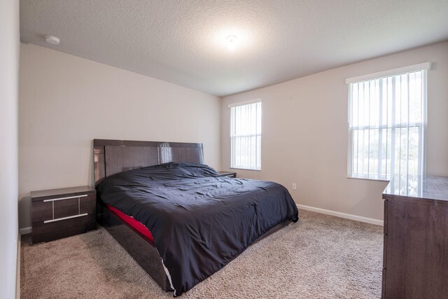 6341 Topsail Dr, West Palm Beach, FL 33413 - carpeted bedroom featuring baseboards and a textured ceiling