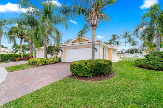 view of property exterior with a garage and a lawn