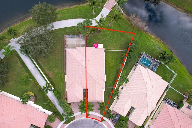 birds eye view of property with a water view